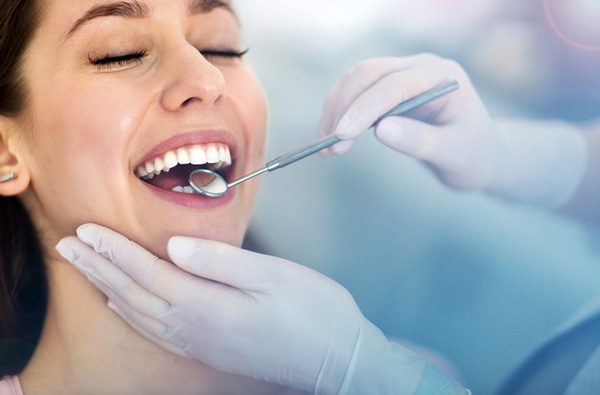 Woman getting dental exam