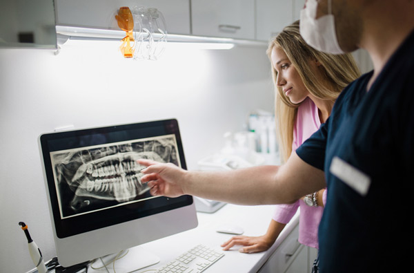 Dentist reviewing a digital xray